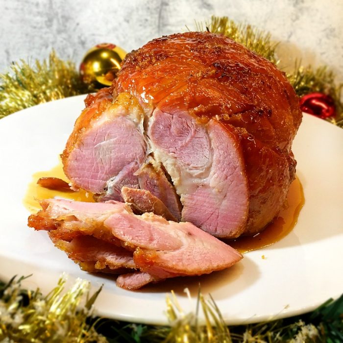 christmas ham cut thinly on a plate