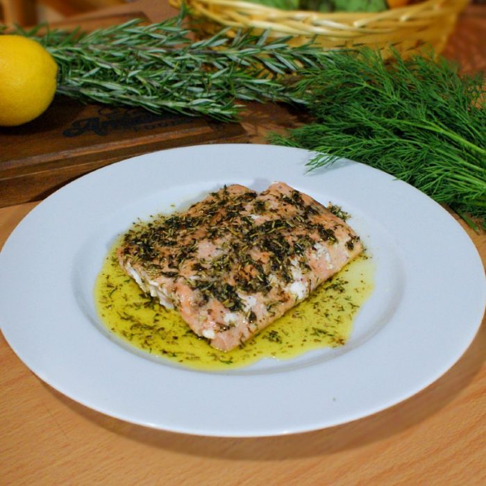 seared salmon and herbs on top of table