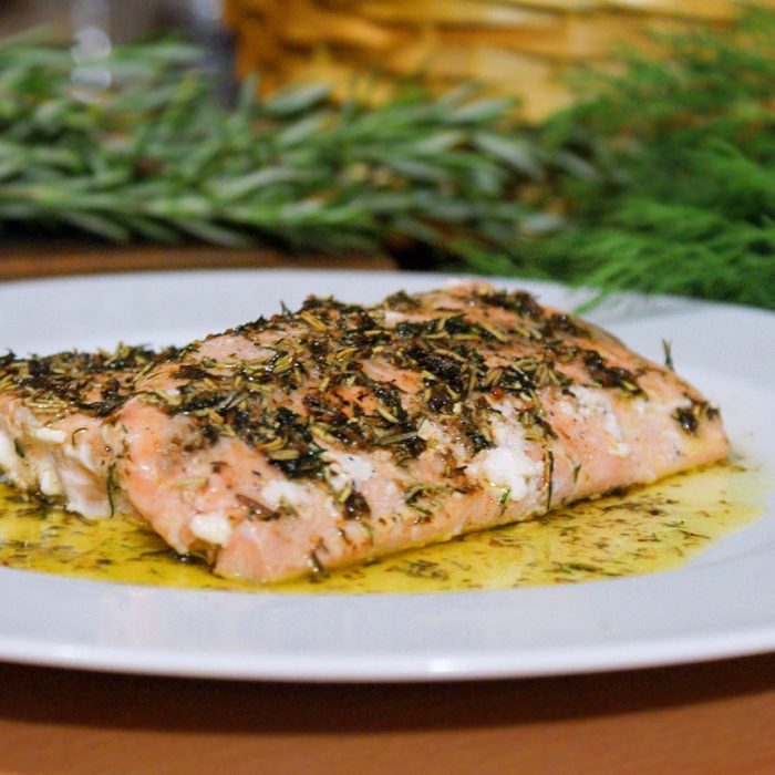 pan-seared salmon with herbs in a plate