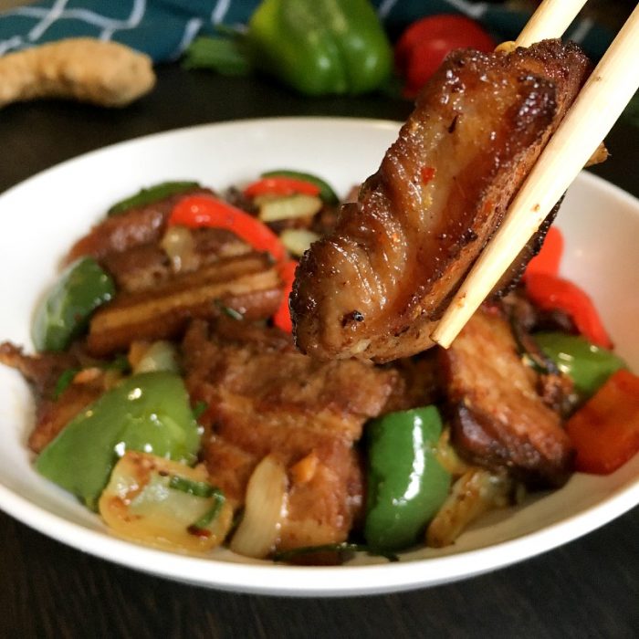 pork stir fry on chopsticks