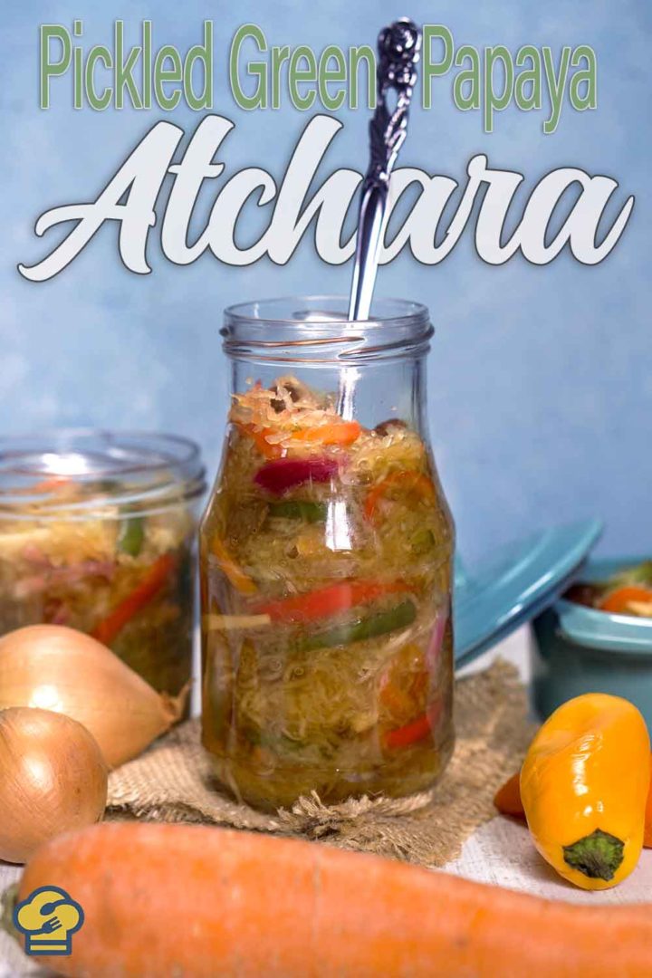 pickled vegetables in a bottle with spoon