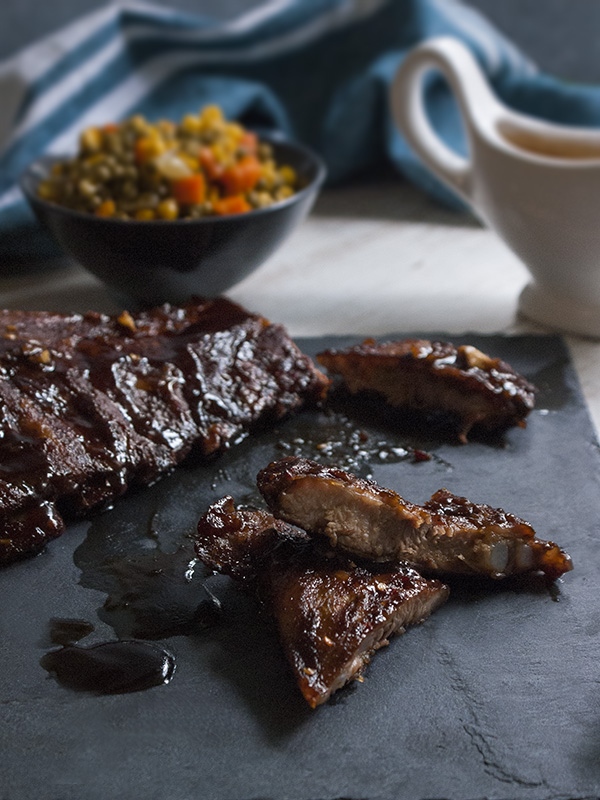 sticky oven barbecue spare ribs on a slab