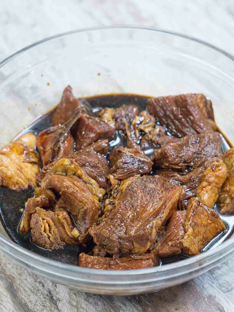 meat marinating in a bowl