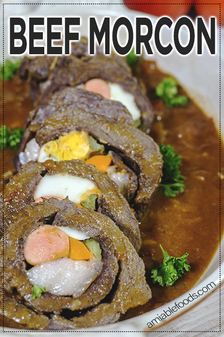 beef roll in a dish with tomato sauce