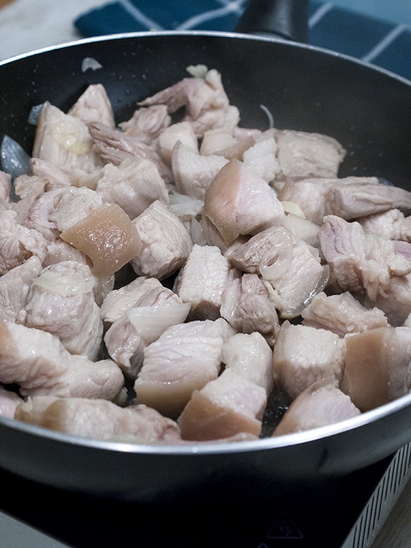 pork cooking in a pan