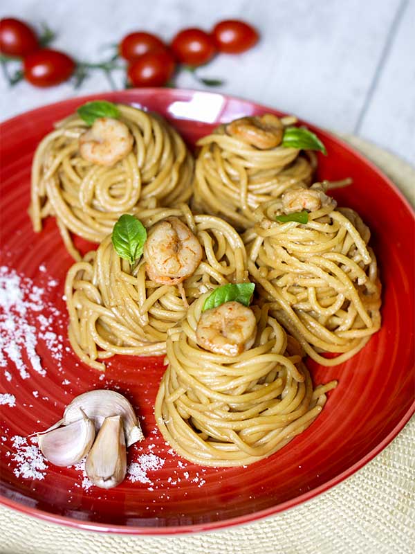 pasta with shrimps and cheese in a plate
