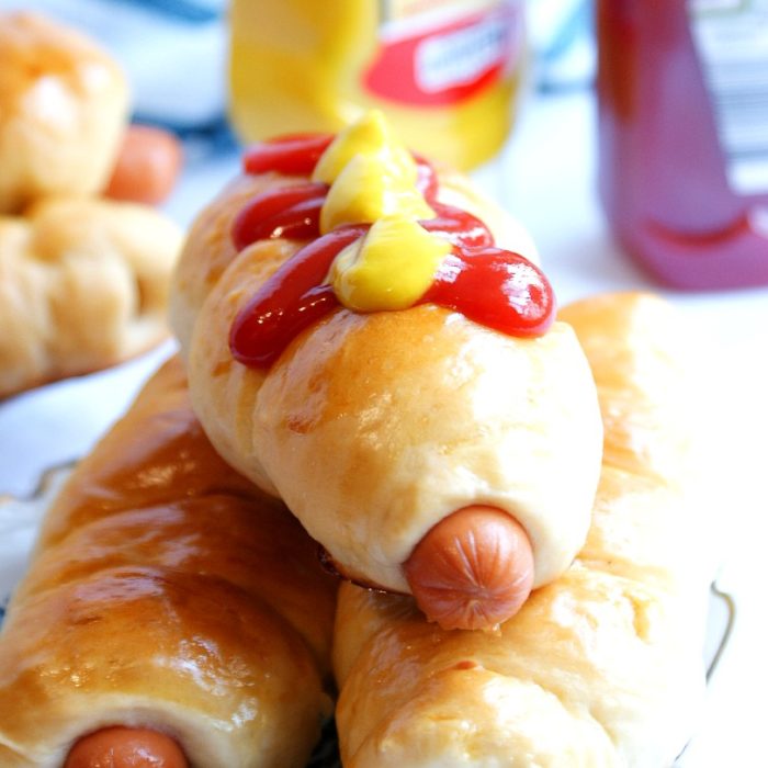 hotdog rolls with mustard and ketchup