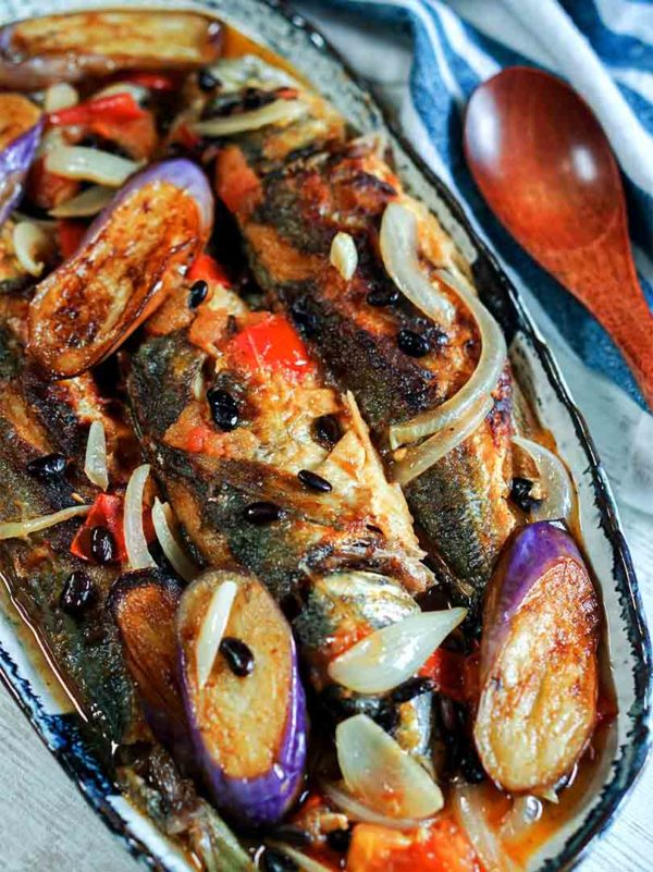 fish with eggplant and tomatoes in a plate