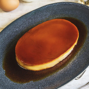 creme caramel in a plate on top of table