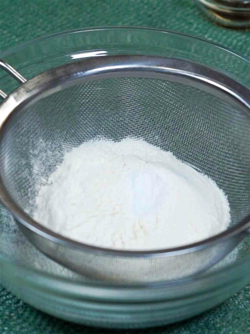sifting flour into bowl