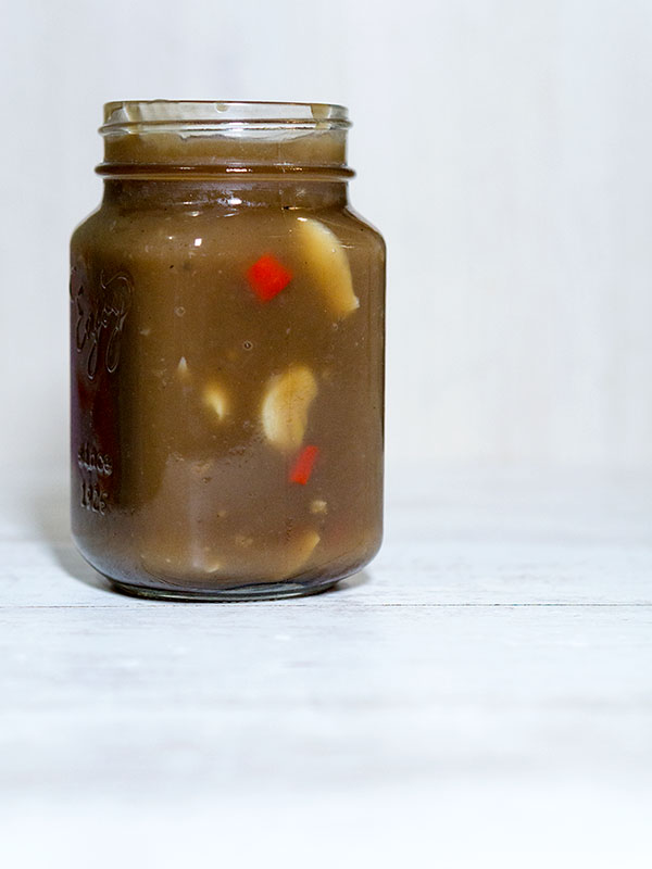 sauce in a jar sitting on top of table