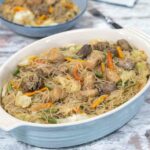 cooked vermicelli with vegetables and meat in a dish