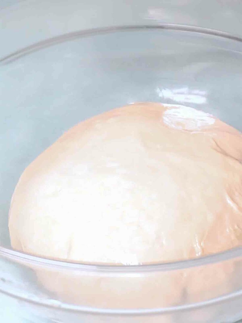 dough in a bowl with cover