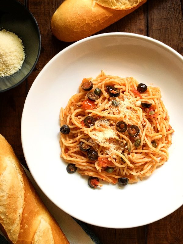 spaghetti alla puttanesca with parmeggiano cheese