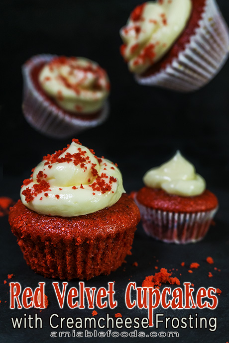mini cakes with frosting and sprinkled with red cake crumbs