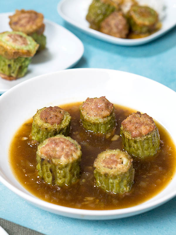 stuffed vegetables with sauce in a plate on top of table