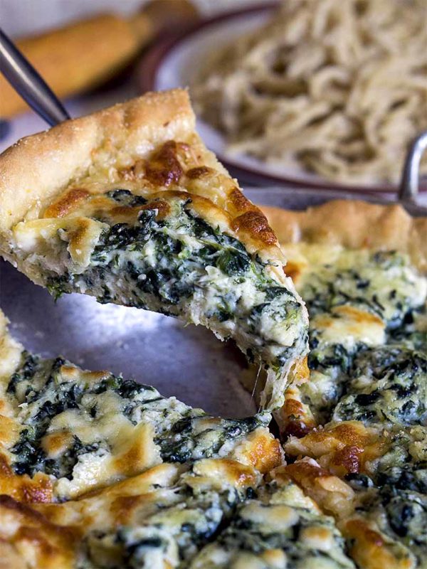 pie with spinach on hand