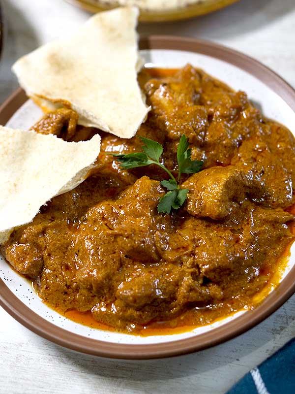 curry in a plate with bread