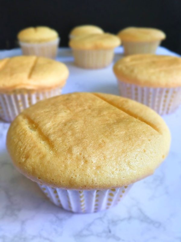 vanilla cupcakes with paper liners